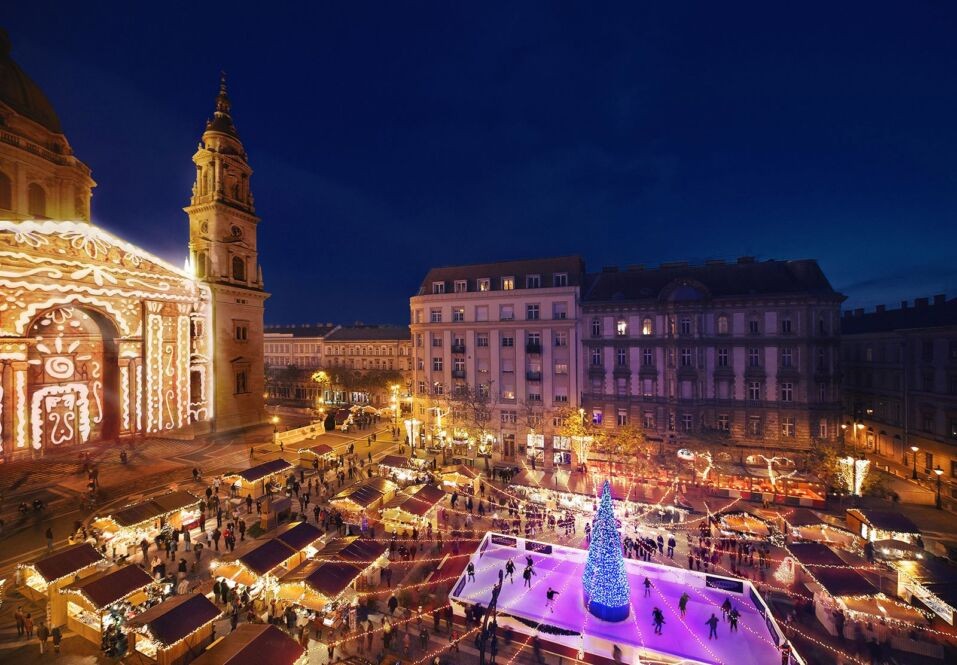 Christmas market stalls lit up at night